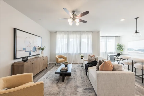 a living room with furniture and window
