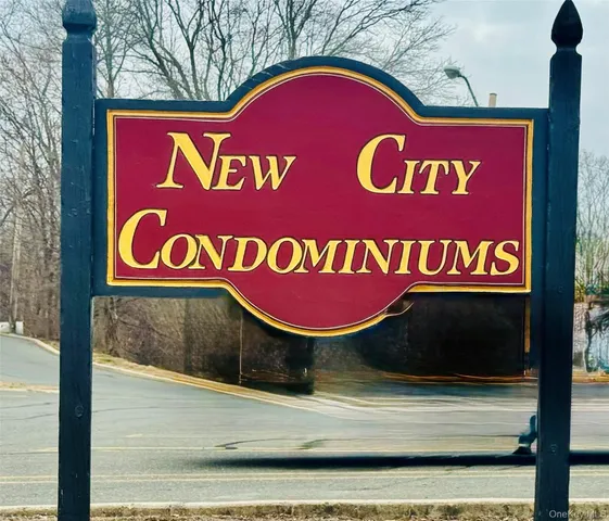 a view of entrance of a house with deck and furniture