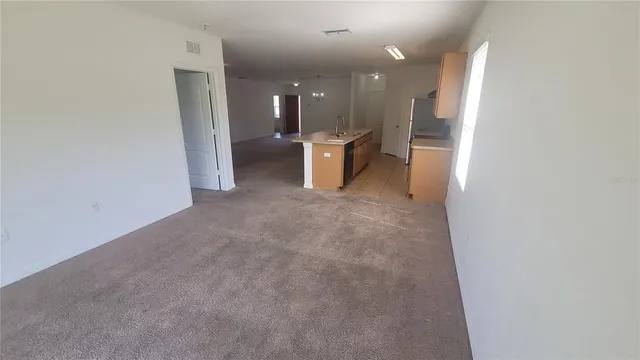 a view of a hallway with a chair