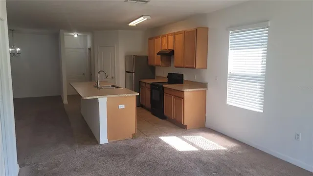 a view of a lake with a house in the background