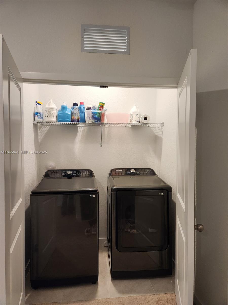 880 Northwest 3rd Way, Unit 880 Pompano Beach, FL 33060 - Photo 17 of 34 a close view of stove top oven