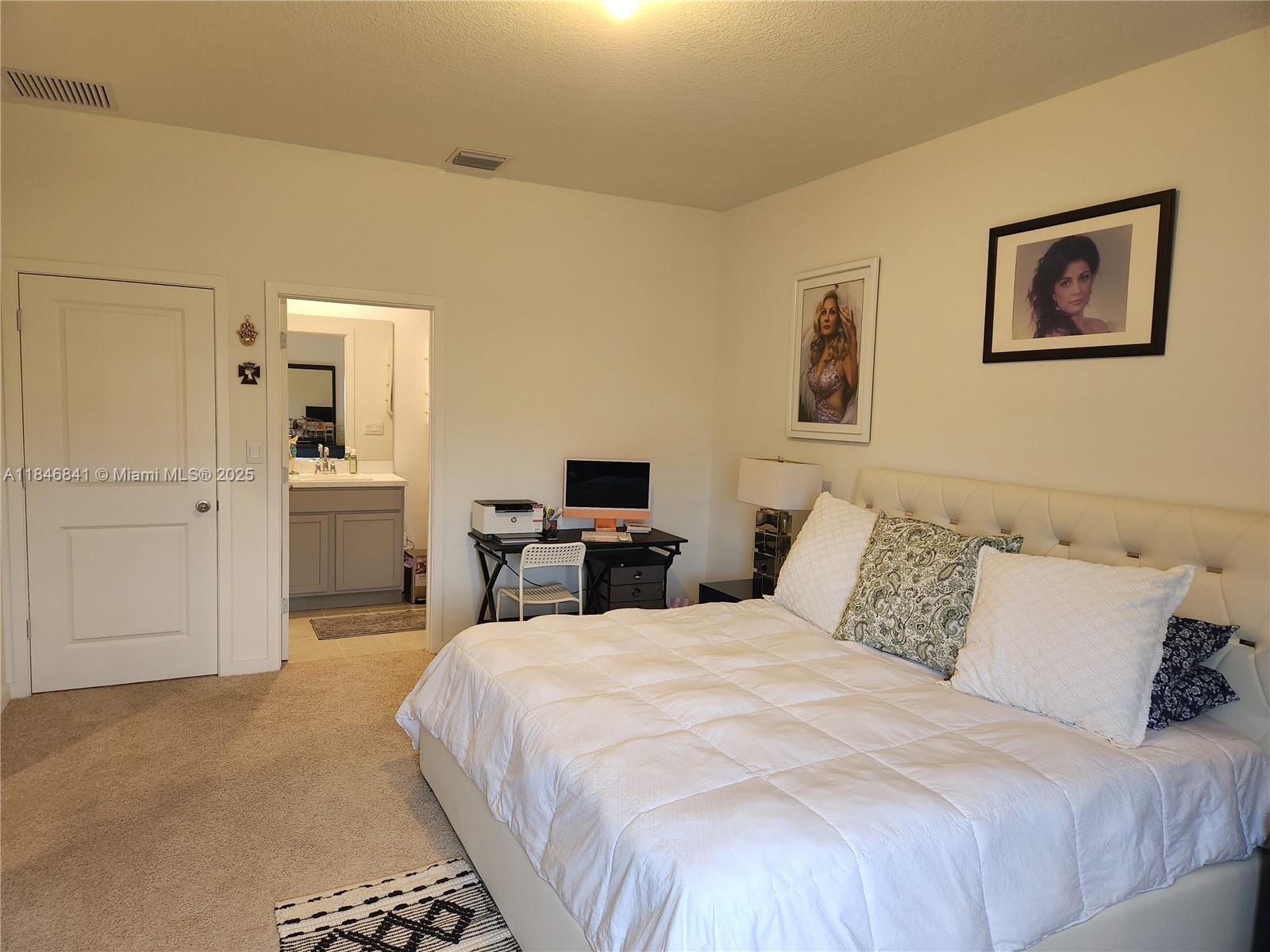 880 Northwest 3rd Way, Unit 880 Pompano Beach, FL 33060 - Photo 27 of 34 a bed room with a bed and a television