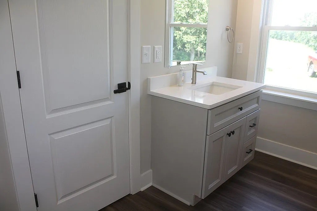7140 Carthage Road Pleasant Shade, TN 37145 - Photo 19 of 36 a bathroom with a sink and a window
