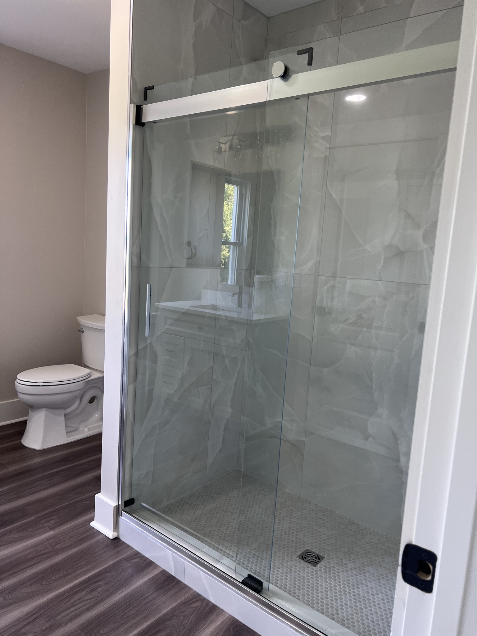 7140 Carthage Road Pleasant Shade, TN 37145 - Photo 21 of 36 a bathroom with a shower and toilet