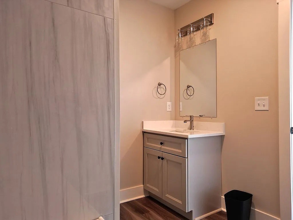 7140 Carthage Road Pleasant Shade, TN 37145 - Photo 29 of 36 a bathroom with a sink a mirror and a shower