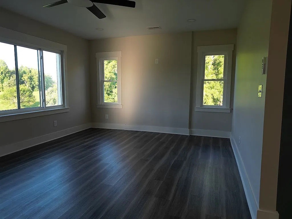 7140 Carthage Road Pleasant Shade, TN 37145 - Photo 33 of 36 a view of an empty room with wooden floor and a window