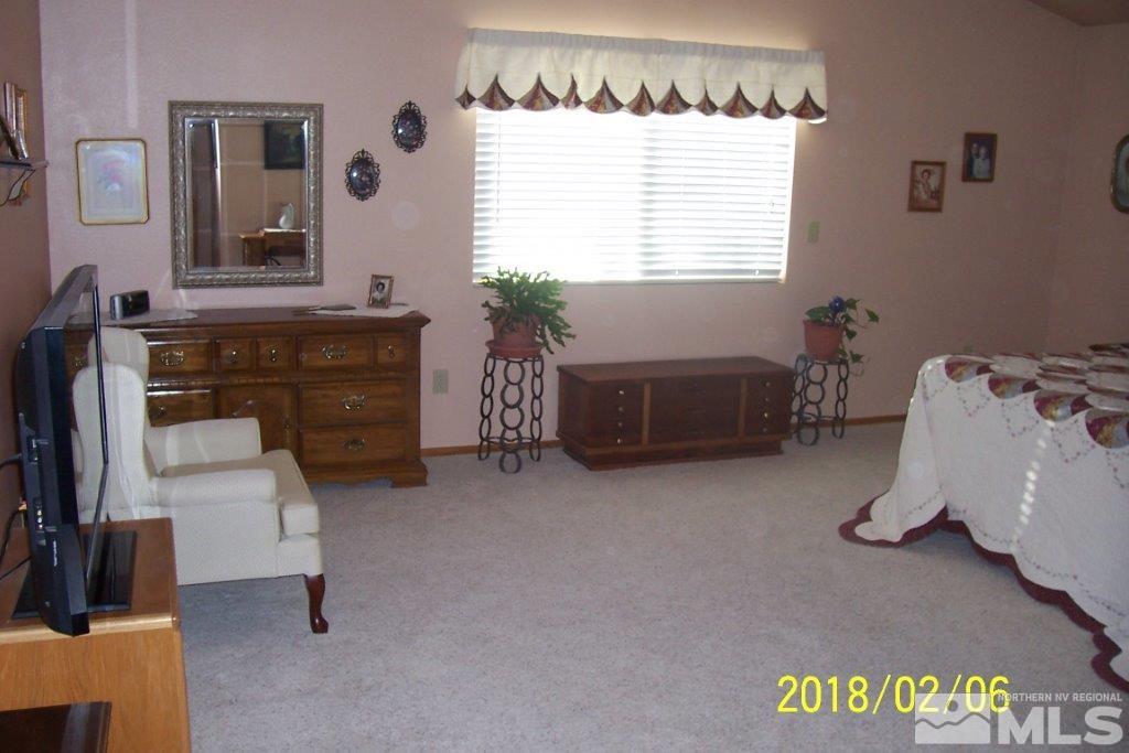 3700 Alcorn Road Fallon, NV 89406 - Photo 11 of 25 a bedroom with a bed and a window