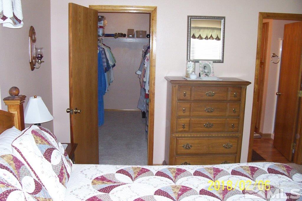 3700 Alcorn Road Fallon, NV 89406 - Photo 12 of 25 a bedroom with a bed and a dresser
