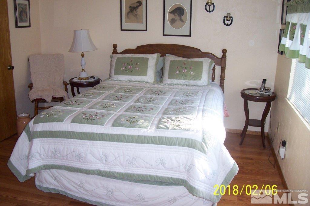 3700 Alcorn Road Fallon, NV 89406 - Photo 13 of 25 a view of a bedroom with furniture and staircase