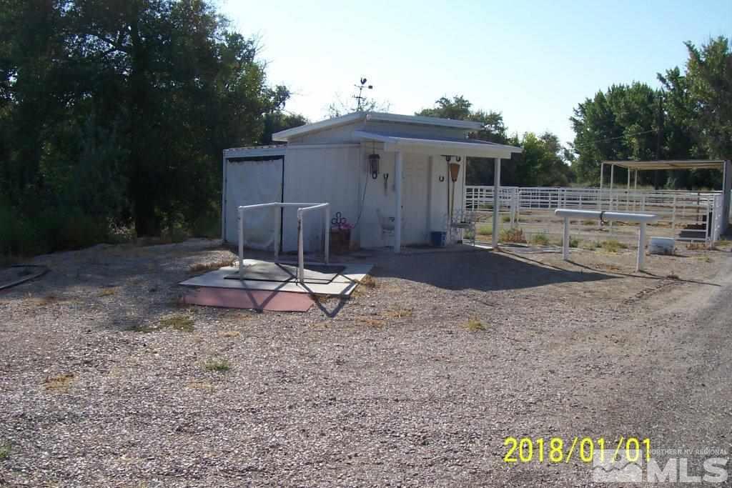 3700 Alcorn Road Fallon, NV 89406 - Photo 17 of 25 a view of a house with backyard and chair