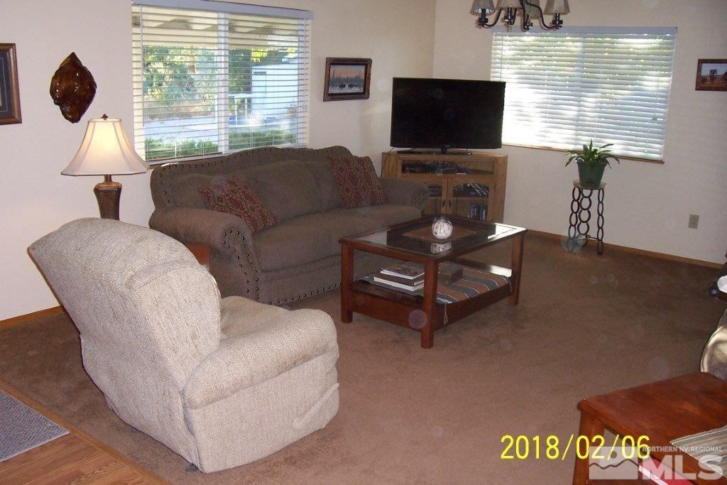 3700 Alcorn Road Fallon, NV 89406 - Photo 3 of 25 a living room with furniture and a flat screen tv