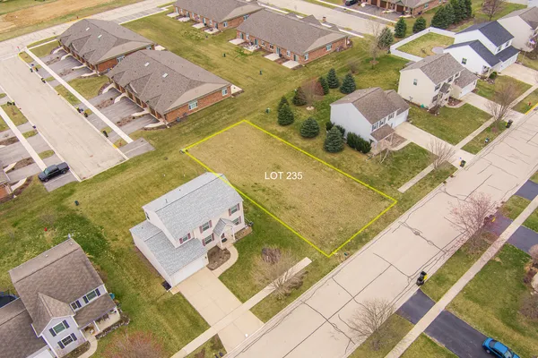 an aerial view of a house with a swimming pool