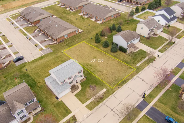 an aerial view of a house with a swimming pool