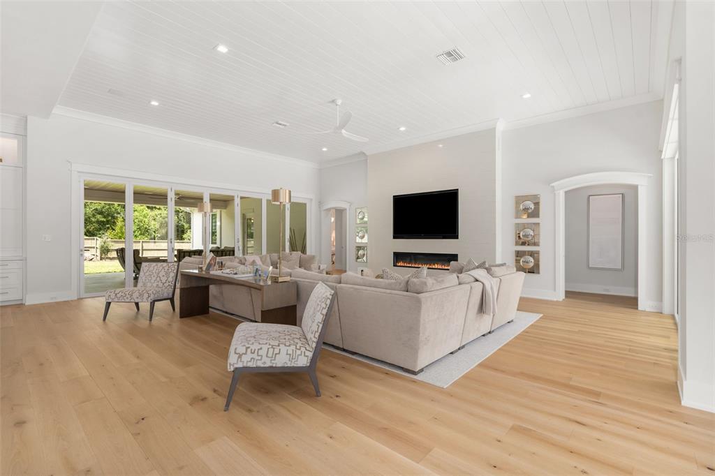 8679 Southwest 28 Lane Gainesville, FL 32608 - Photo 16 of 64 a living room with furniture and a flat screen tv