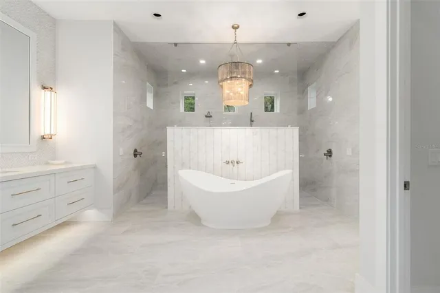 a bathroom with a double vanity sink mirror and shower