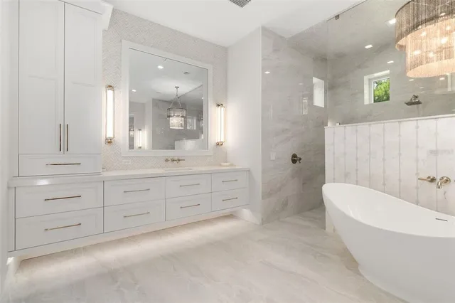 a bedroom with a bed and flat screen tv