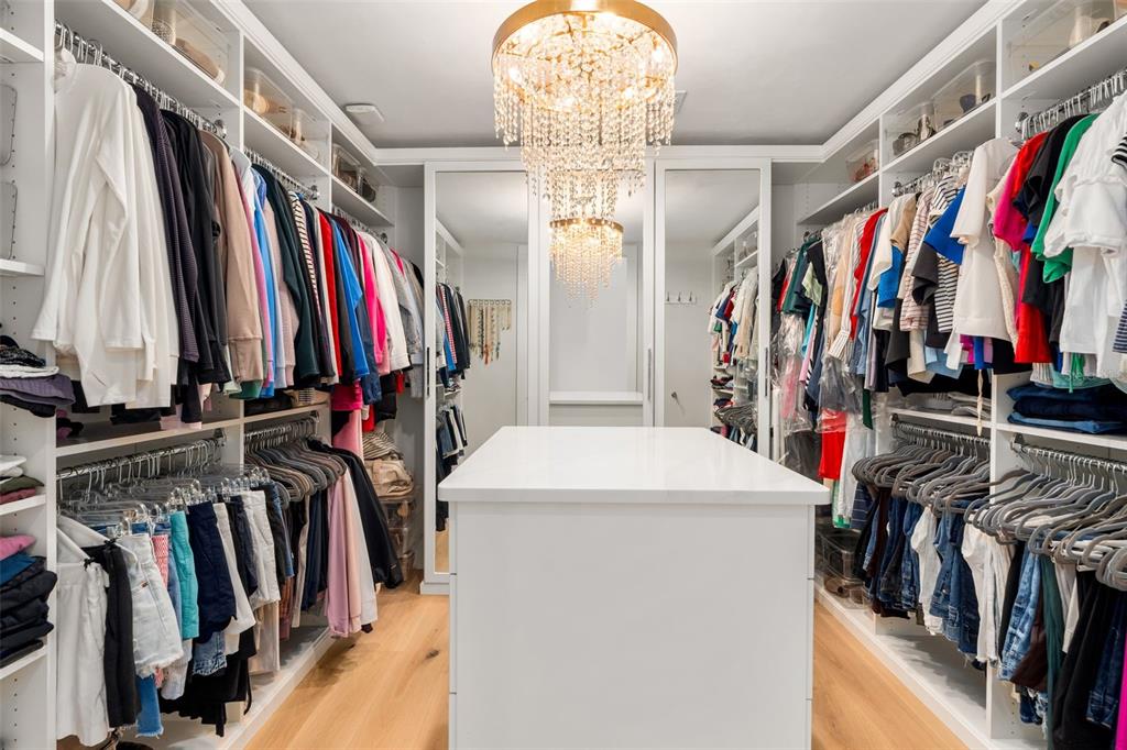 8679 Southwest 28 Lane Gainesville, FL 32608 - Photo 23 of 64 a view of walk in closet with clothes