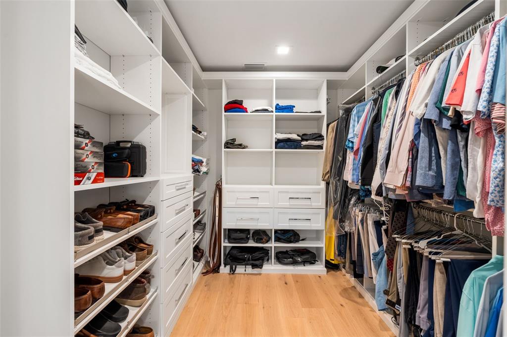 8679 Southwest 28 Lane Gainesville, FL 32608 - Photo 24 of 64 a view of walk in closet with clothes and shoes