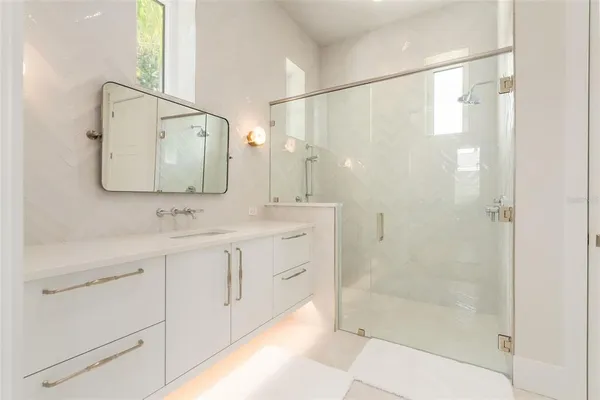 a bathroom with a bathtub and shower