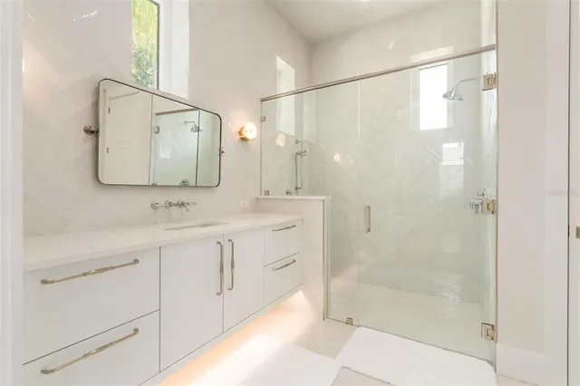 a bathroom with a bathtub and shower