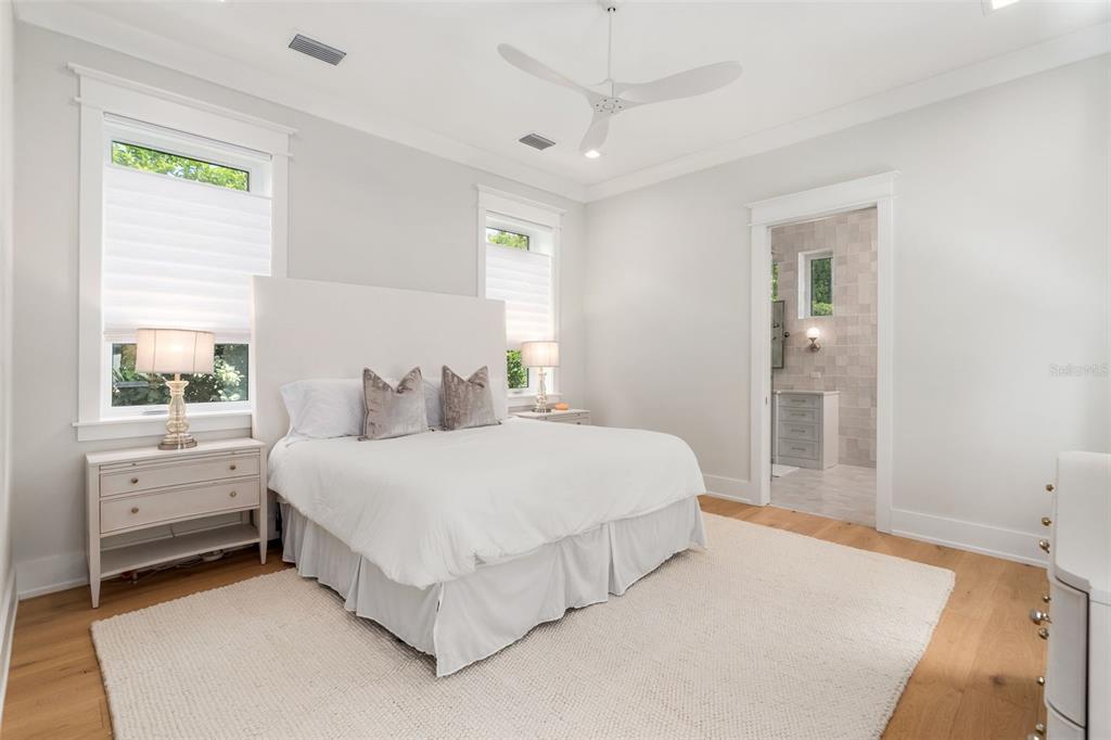 8679 Southwest 28 Lane Gainesville, FL 32608 - Photo 28 of 64 a spacious bedroom with a bed and a window