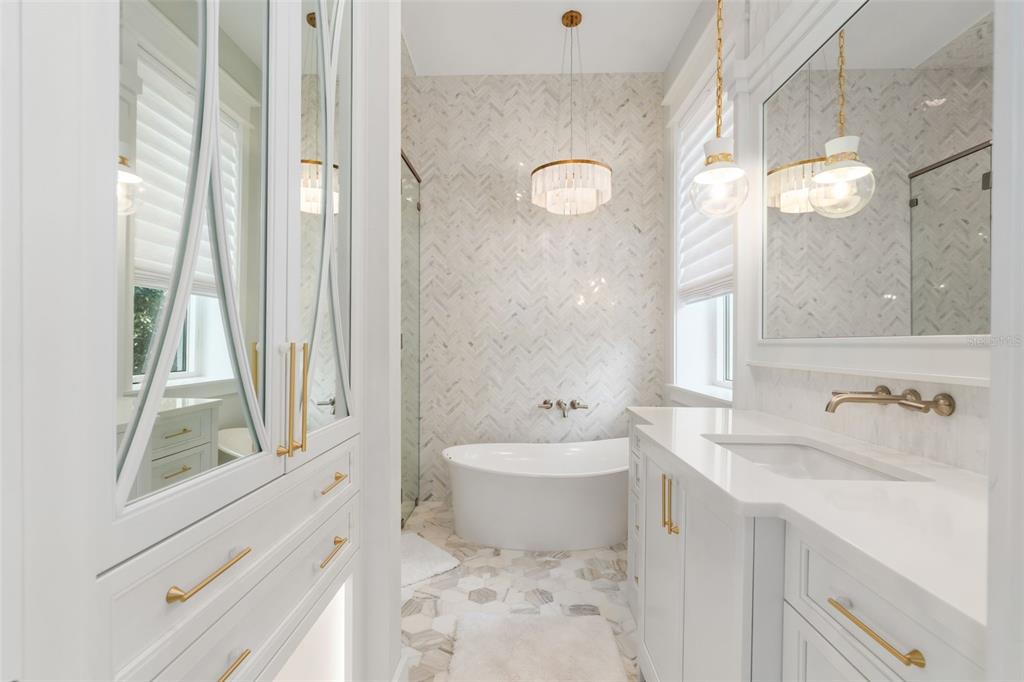 8679 Southwest 28 Lane Gainesville, FL 32608 - Photo 35 of 64 a bathroom with a sink a toilet and a bathtub