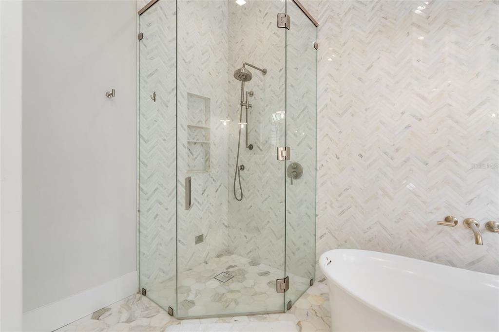 8679 Southwest 28 Lane Gainesville, FL 32608 - Photo 36 of 64 a bathroom with a bathtub and shower