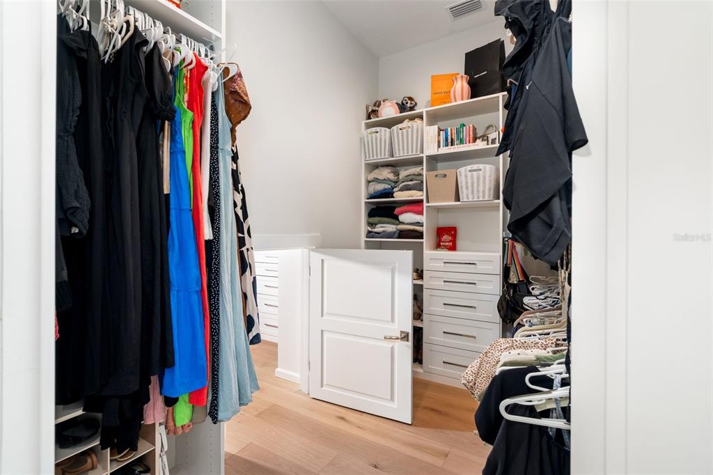 8679 Southwest 28 Lane Gainesville, FL 32608 - Photo 37 of 64 a view of walk in closet with clothes and shoes