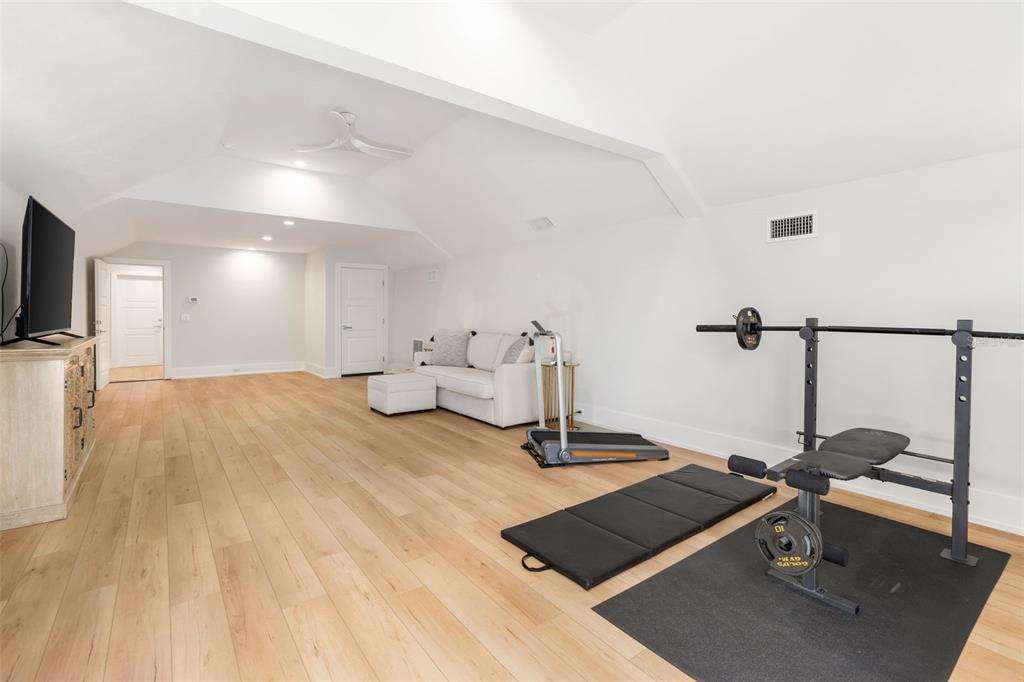 8679 Southwest 28 Lane Gainesville, FL 32608 - Photo 46 of 64 a view of a room with gym equipment