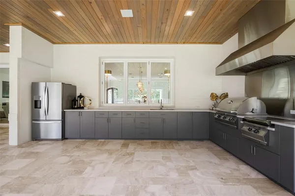 an aerial view of residential house with outdoor space and swimming pool