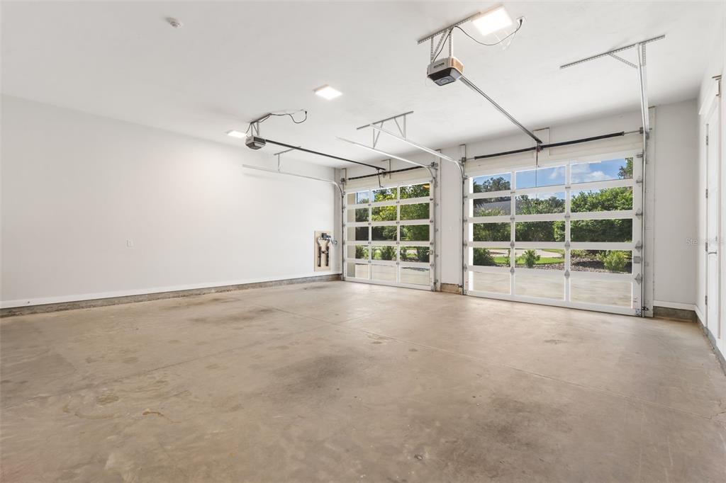 8679 Southwest 28 Lane Gainesville, FL 32608 - Photo 51 of 64 a view of an empty room with a window and ceiling fan