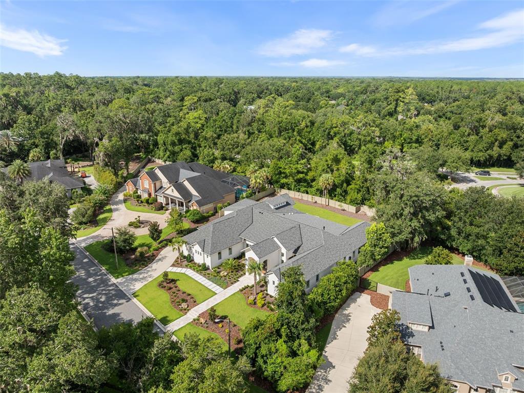 8679 Southwest 28 Lane Gainesville, FL 32608 - Photo 59 of 64 an aerial view of a house with a yard