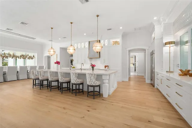 a view of a kitchen with cabinets and a wooden floor