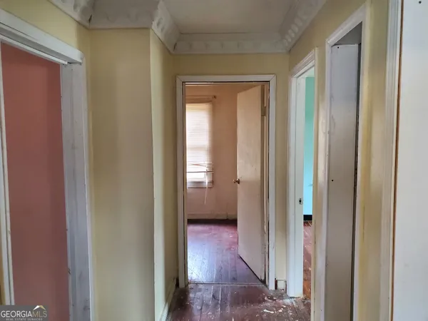 a view of a bathroom from a hallway