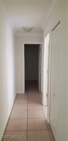 a view of an empty room with a hallway