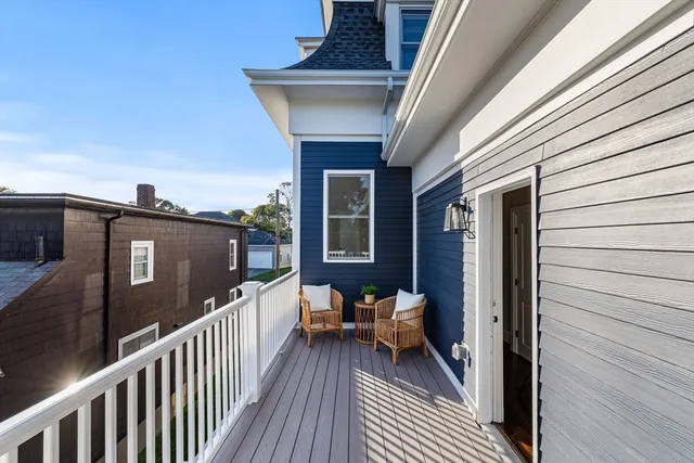 a view of a balcony with furniture