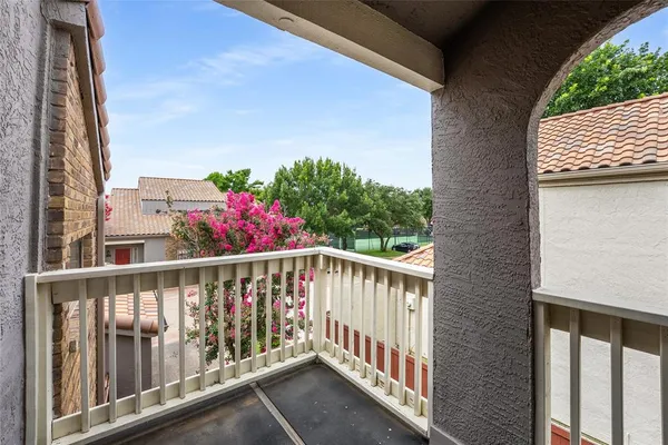 a view of a balcony with an outdoor space