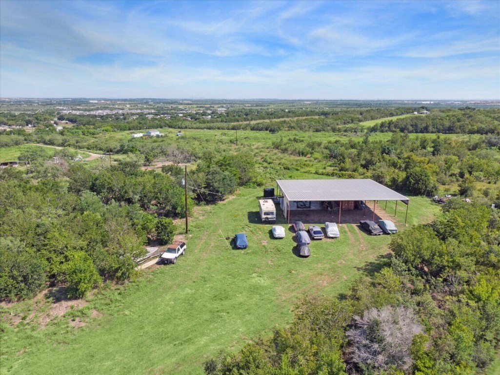 View from above of property with a heavily wooded area