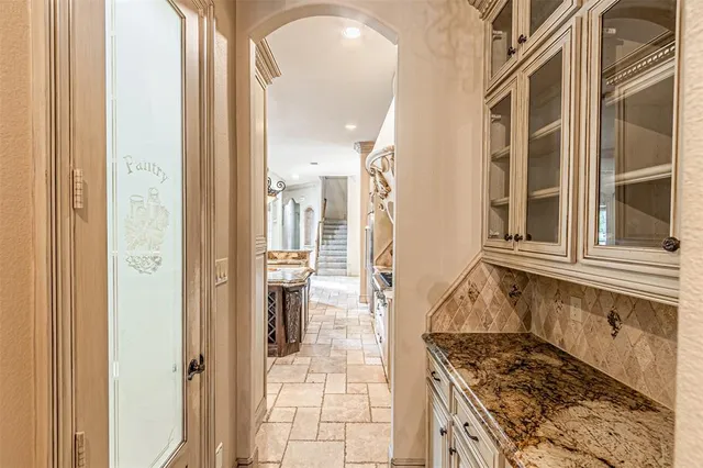 a kitchen with a stove and a refrigerator