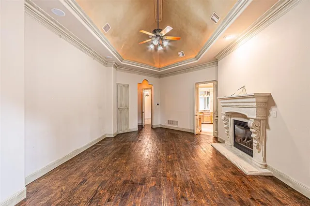 a view of livingroom with fireplace fan and window
