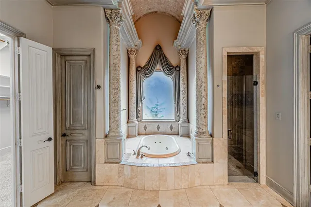 a view of bathroom with a tub and shower