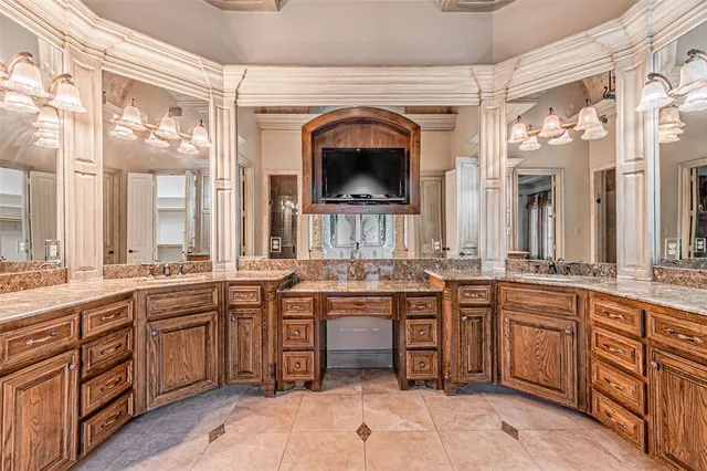 a kitchen with a sink and cabinets