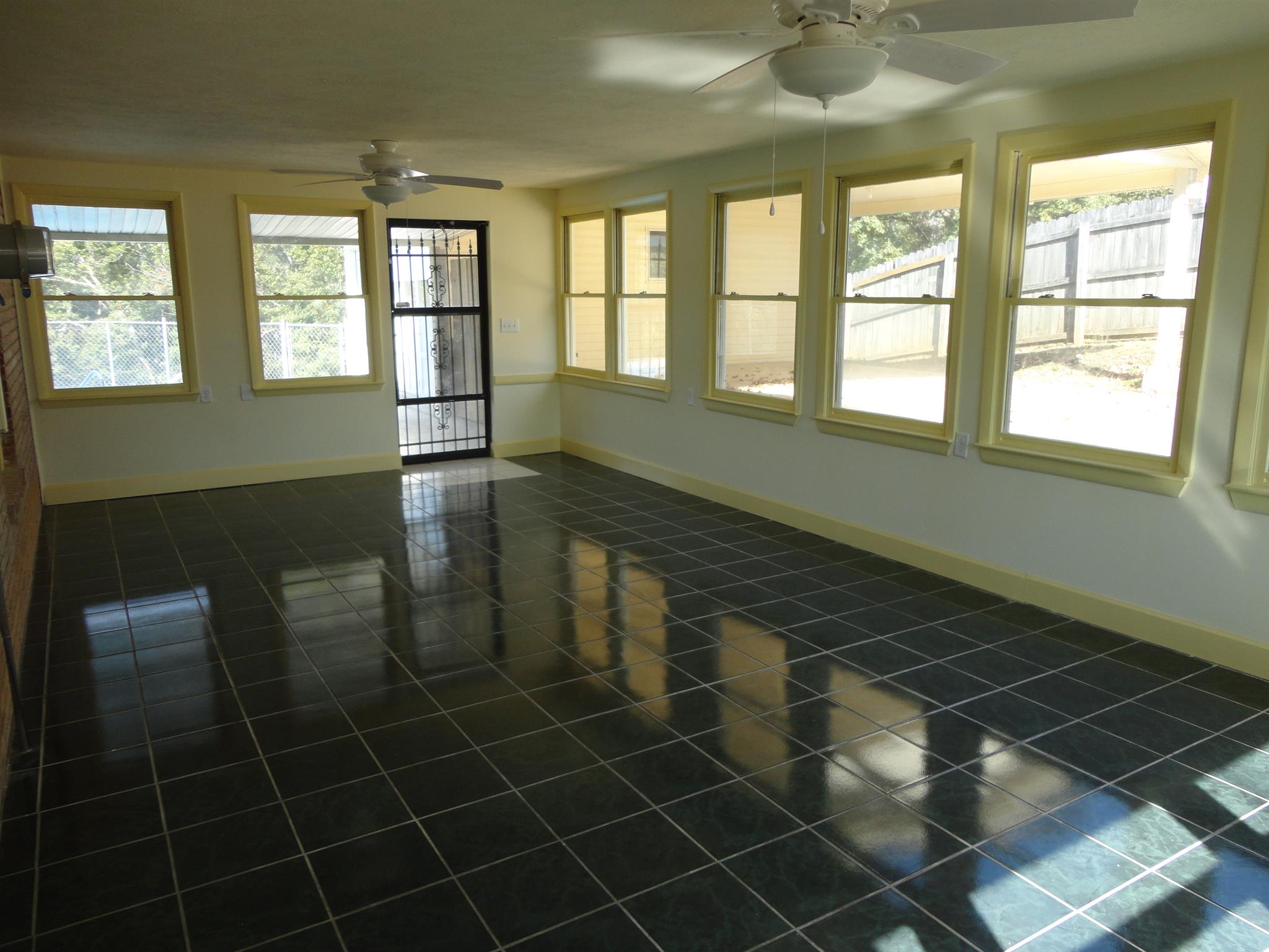 1665 Johnson Chapel Road Sparta, TN 38583 - Photo 16 of 26 Sunroom has a wall of windows for loads of natural light, tile floor, door to pool area.
