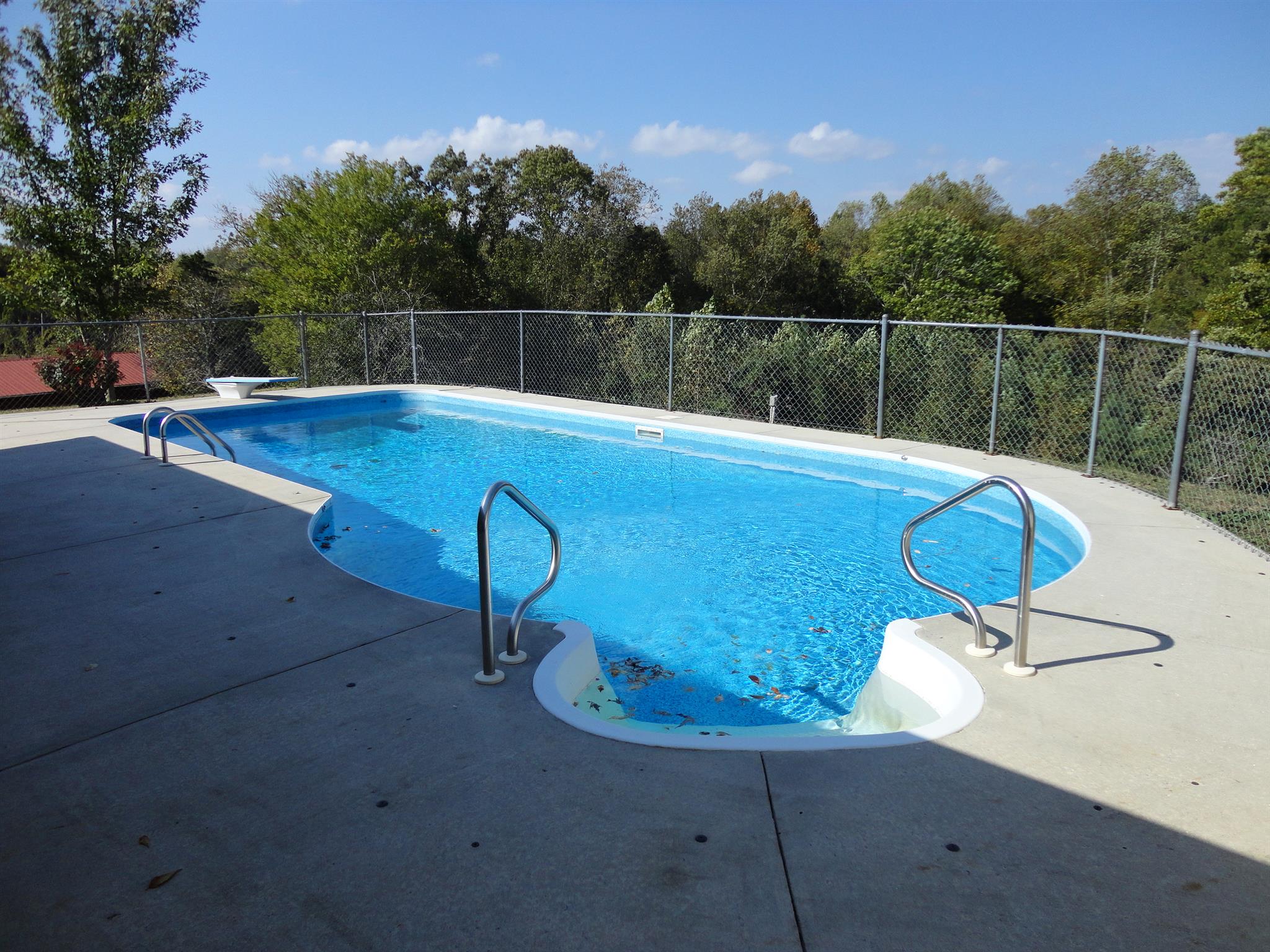 1665 Johnson Chapel Road Sparta, TN 38583 - Photo 22 of 26 Inground pool is fenced in with a changing room and pool storage area