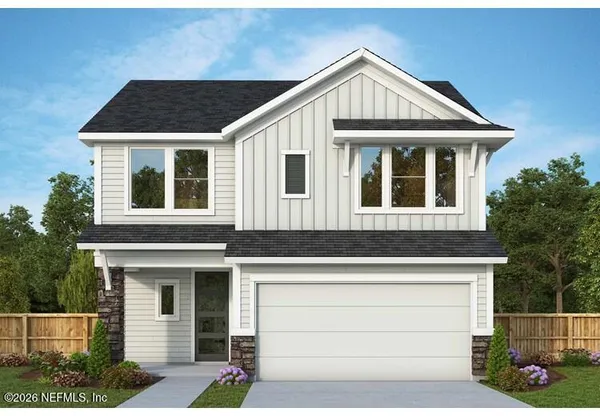 a front view of a house with garage