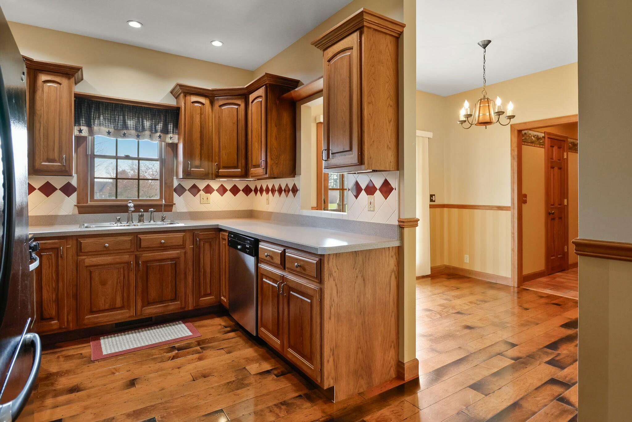 172 Lee Drive Kouts, IN 46347 - Photo 15 of 63 a kitchen with a sink stove and refrigerator