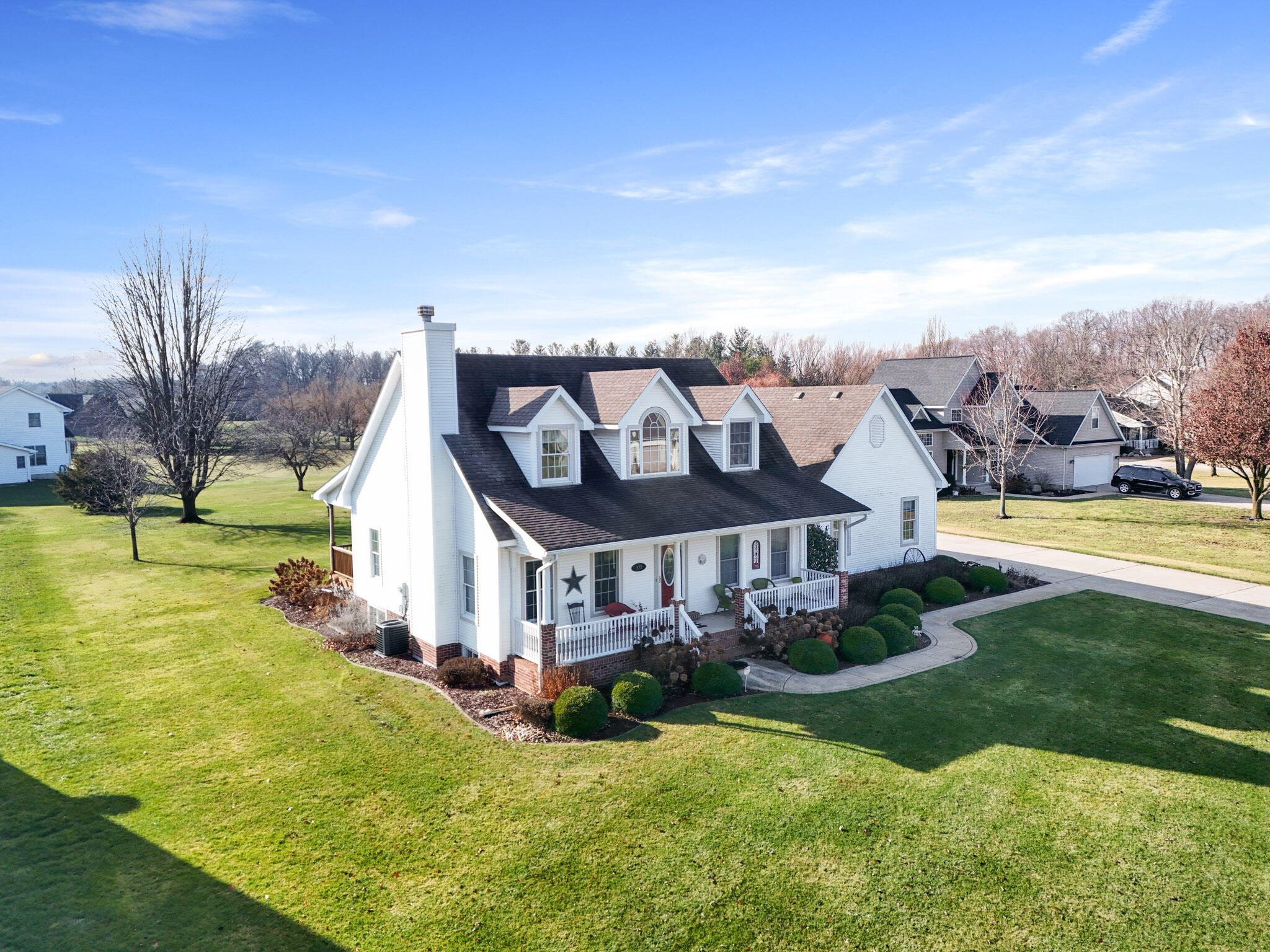 172 Lee Drive Kouts, IN 46347 - Photo 51 of 63 a view of a big house with a big yard potted plants and large tree