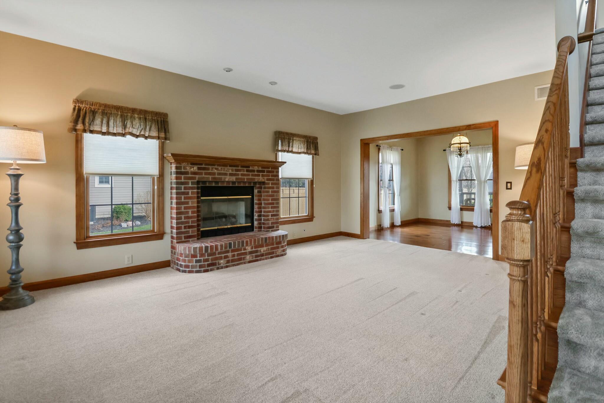 172 Lee Drive Kouts, IN 46347 - Photo 10 of 63 a living room with furniture and a fireplace