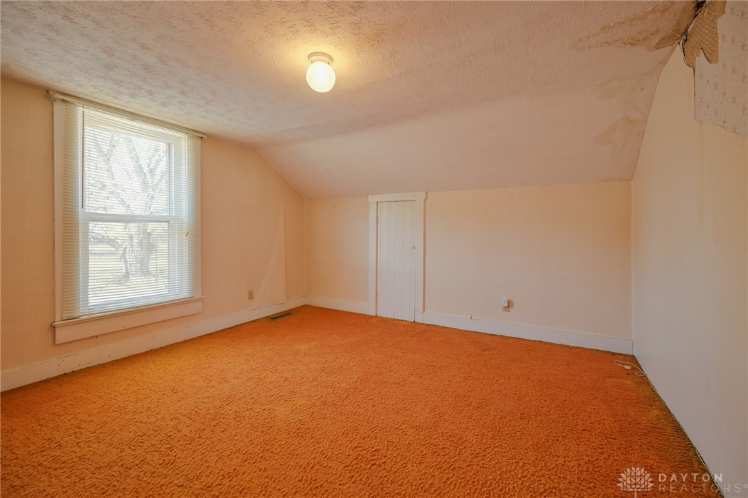 3057 Springfield Xenia Road Springfield, OH 45506 - Photo 7 of 37 This spacious room features a window offering abundant natural light and has carpet flooring.