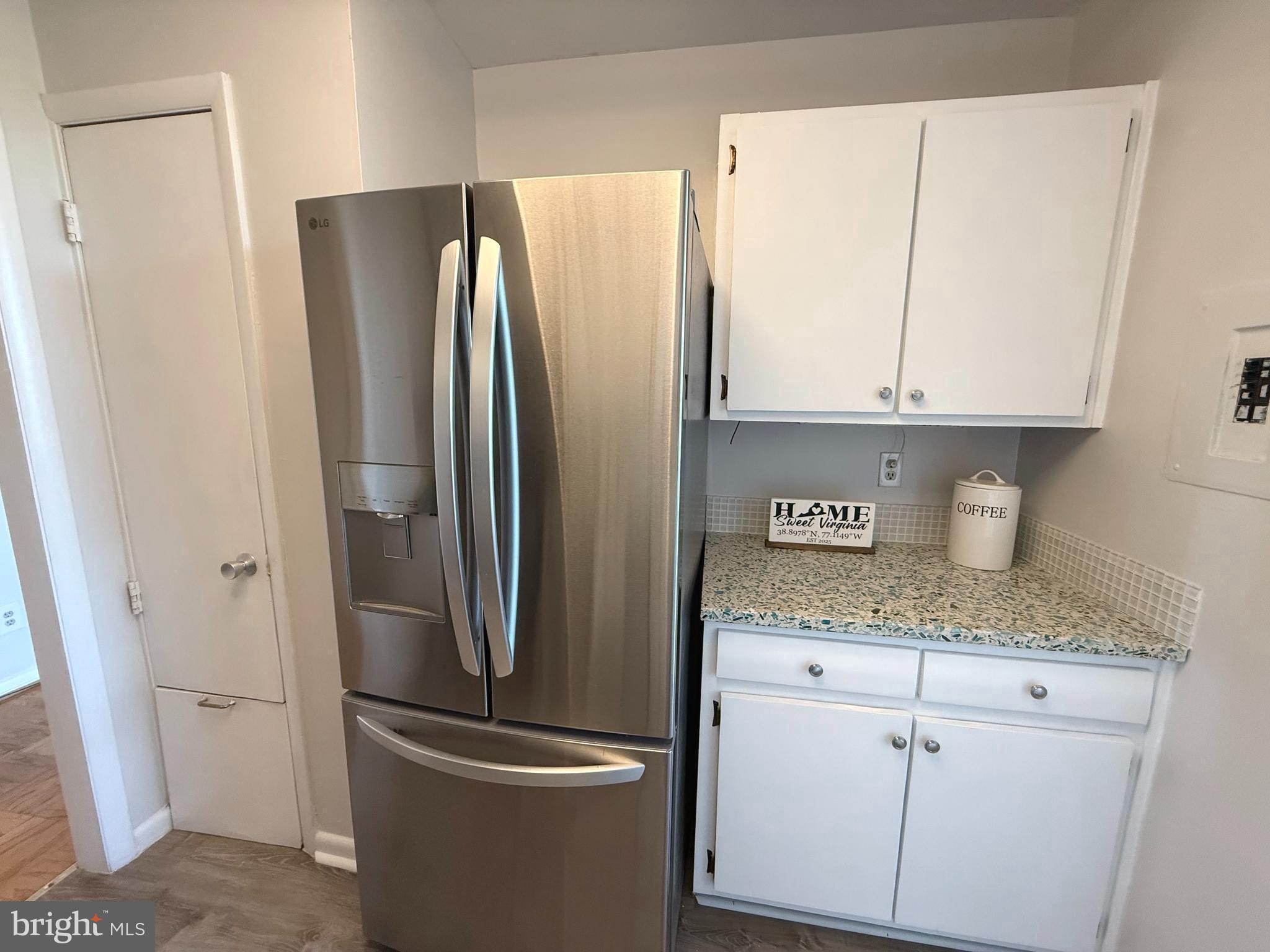 4343 Cherry Hill Road, Unit 705 Arlington, VA 22207 - Photo 12 of 38 a kitchen with stainless steel appliances granite countertop a refrigerator and a sink